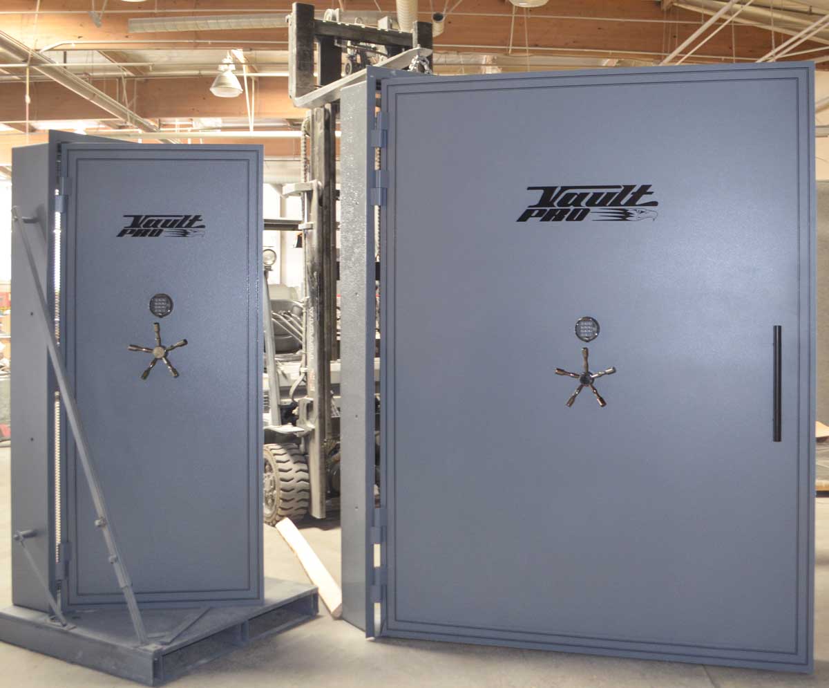Standard size vault door next to a super size vault door in final inspection