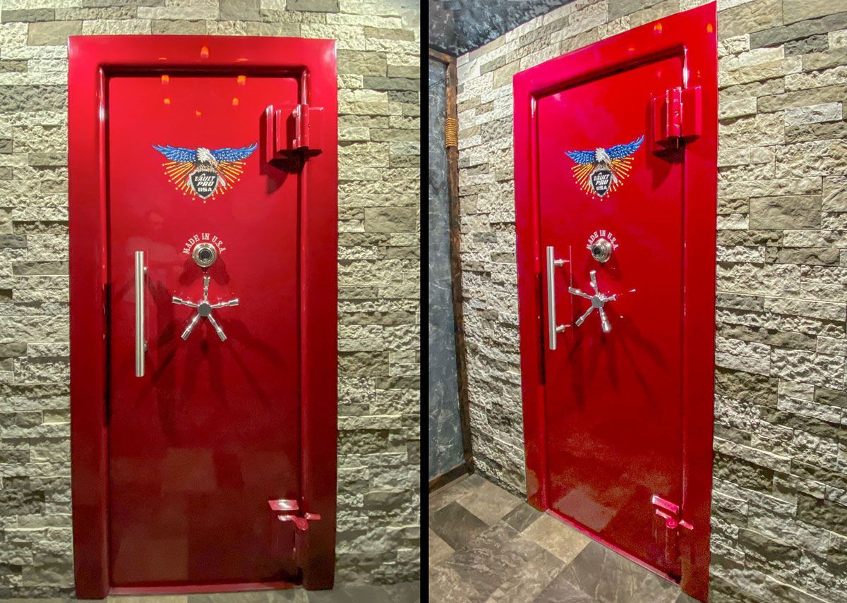 large vault door in red gloss finish installed in wall with rock style tiles