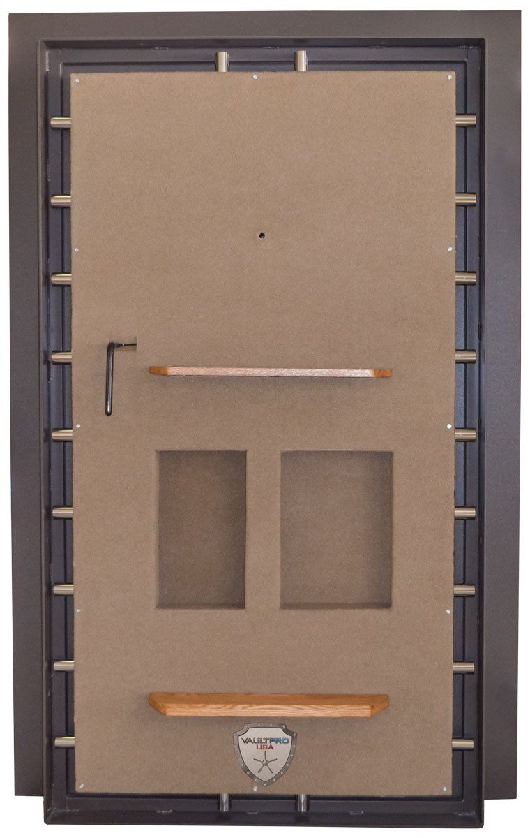 Vault door with rifle rack for scopes and emergency release