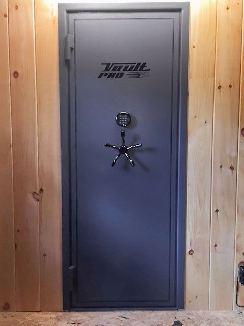 Vault Door custom installation with wood paneling.