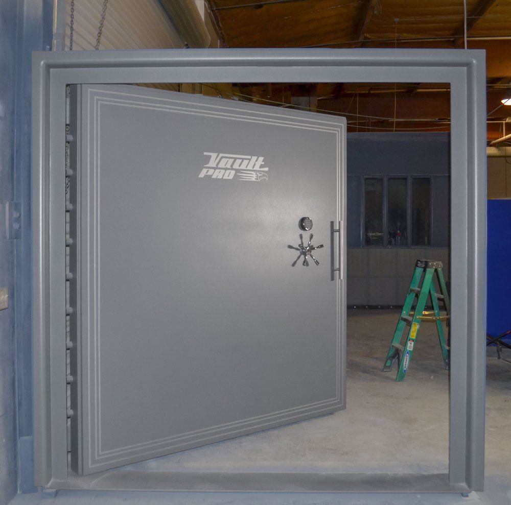 Massive vault door for automobile garage