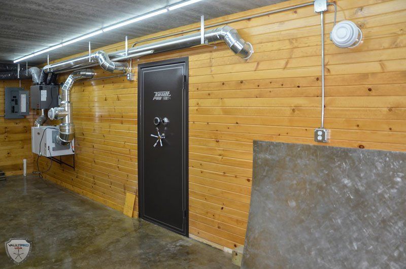 paneled walk in gun vault room