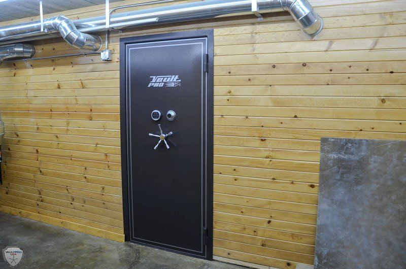 Custom walk in wood panel vault room door.