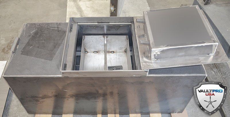 Custom Floor Safe compartment with removeable tray system and below trays long gun storage.