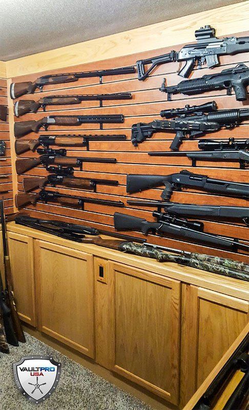 Shotgun, Rifle and Assault weapon storage in hidden vault room.
