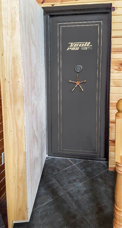 Hidden vault room door open revealing vault door.