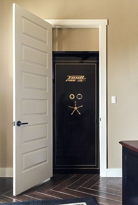 hidden vault door behind wood door