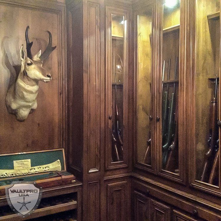 custom hidden vault room walk in gun room with hidden vault door