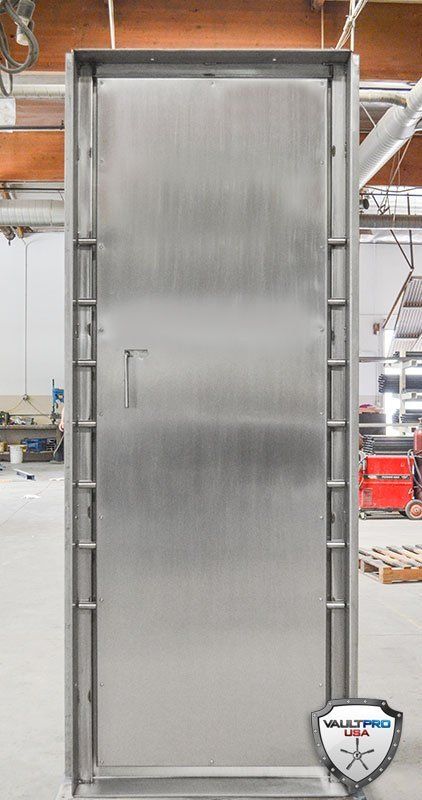 100% American Made Solid Stainless Steel Vault Door with Custom Stainless Steel dual cam system keeps the locking bolts perfectly aligned.
