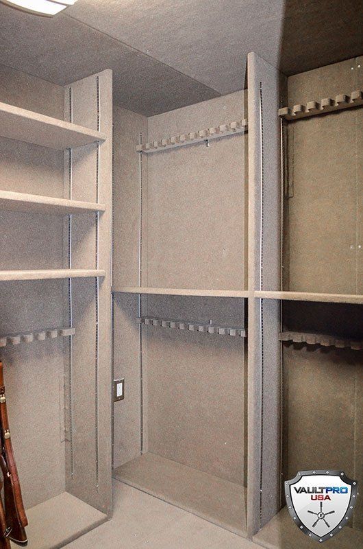 Floor to ceiling gun racks for walk-in vault.