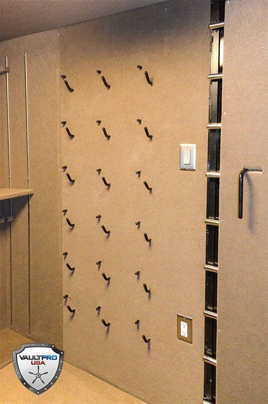 walk in vault room with pistol holders and lighting
