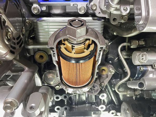 Cutaway view of an engine oil filter showing the filter media and housing. | Auto Clinic Care