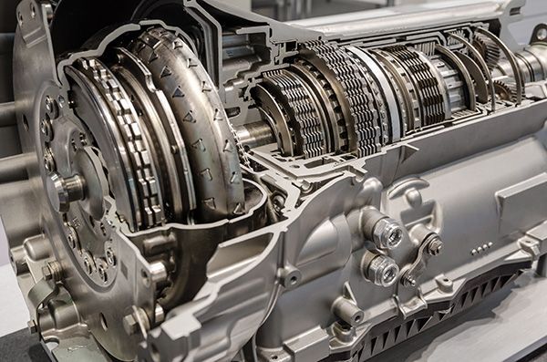 Cutaway view of an automatic transmission, revealing gears and internal components. Silver metal construction. | Auto Clinic Care
