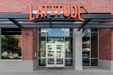 Latitude student apartment community building front door view.