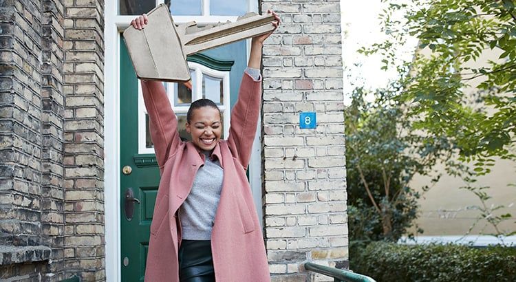 Woman celebrating buying new home