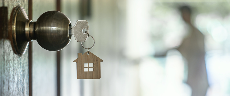 key in door of new home