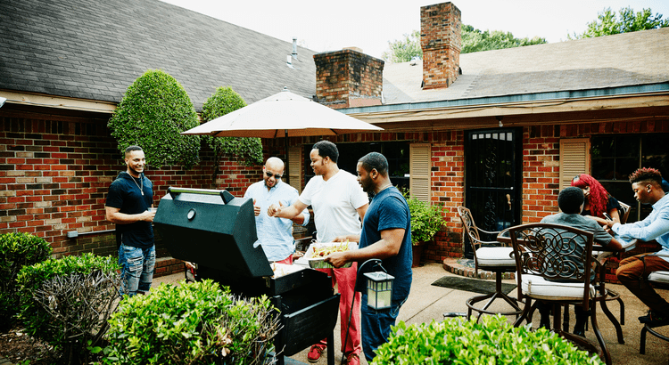 Family cooking out-featured image for Why the Sandwich Generation is Buying Multi-Generational Homes