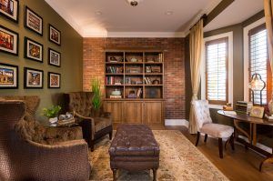 City Square Model Home - formal library with brick accent wall