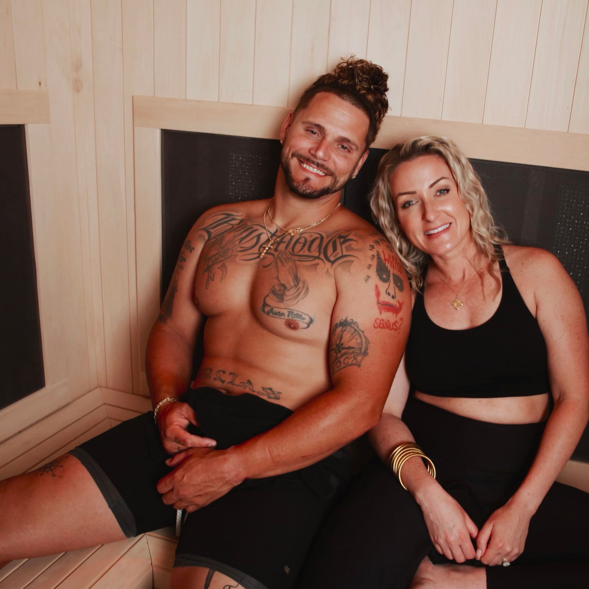 A towel is hanging on a ladder in a bathroom next to a bathtub.
