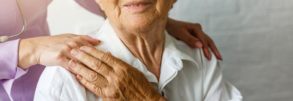Elderly female hand holding hand of young caregiver — Aged Care in Tamworth, NSW