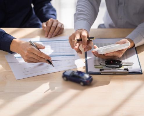 Image of two business people reviewing paperwork.