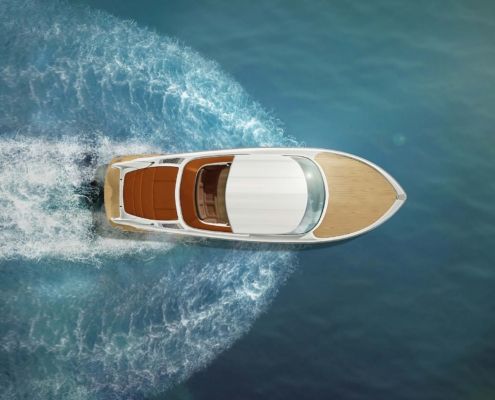 An aerial view of a boat floating on top of a body of water.