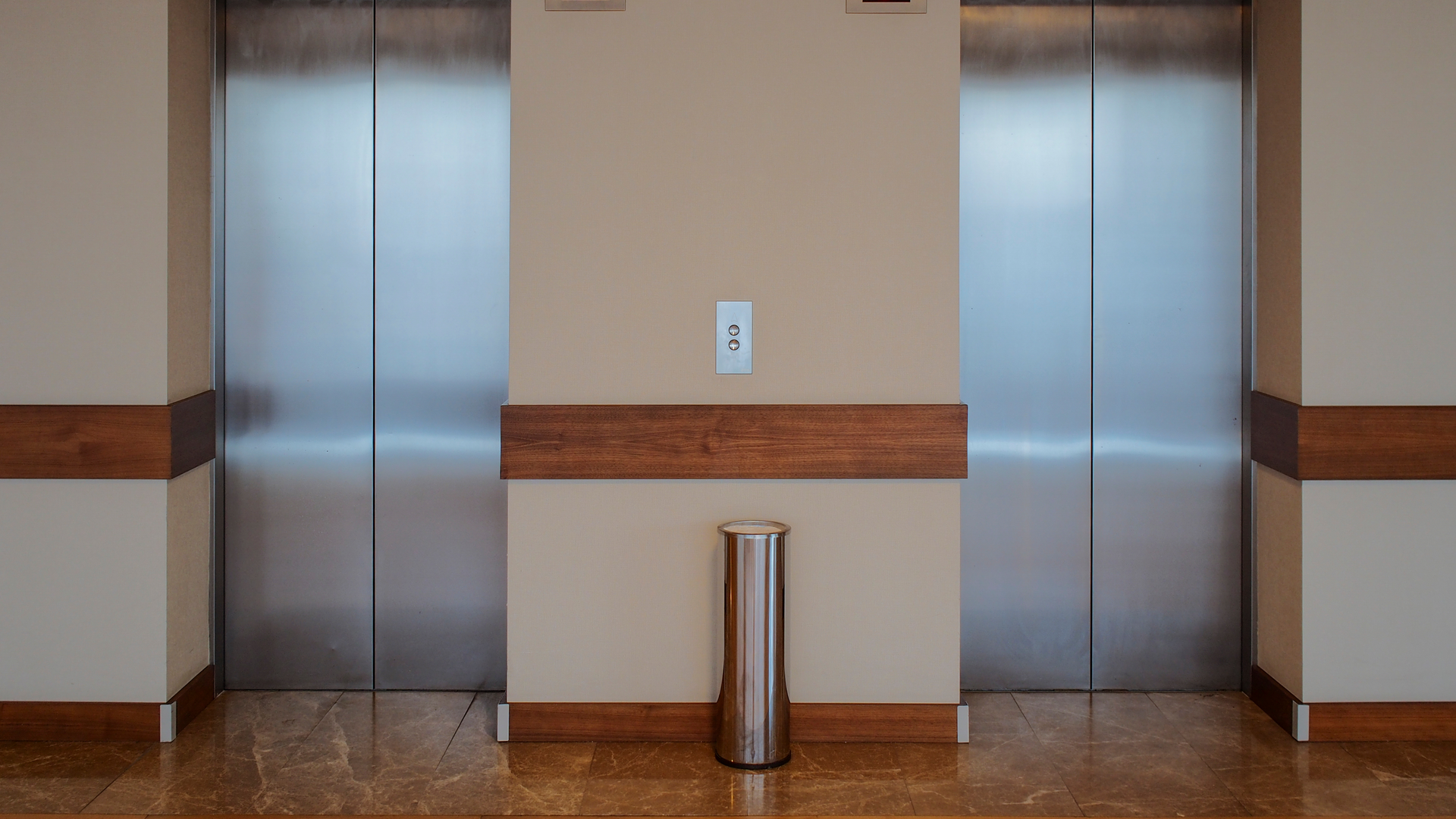 A warehouse with a staircase and a sign that says danger