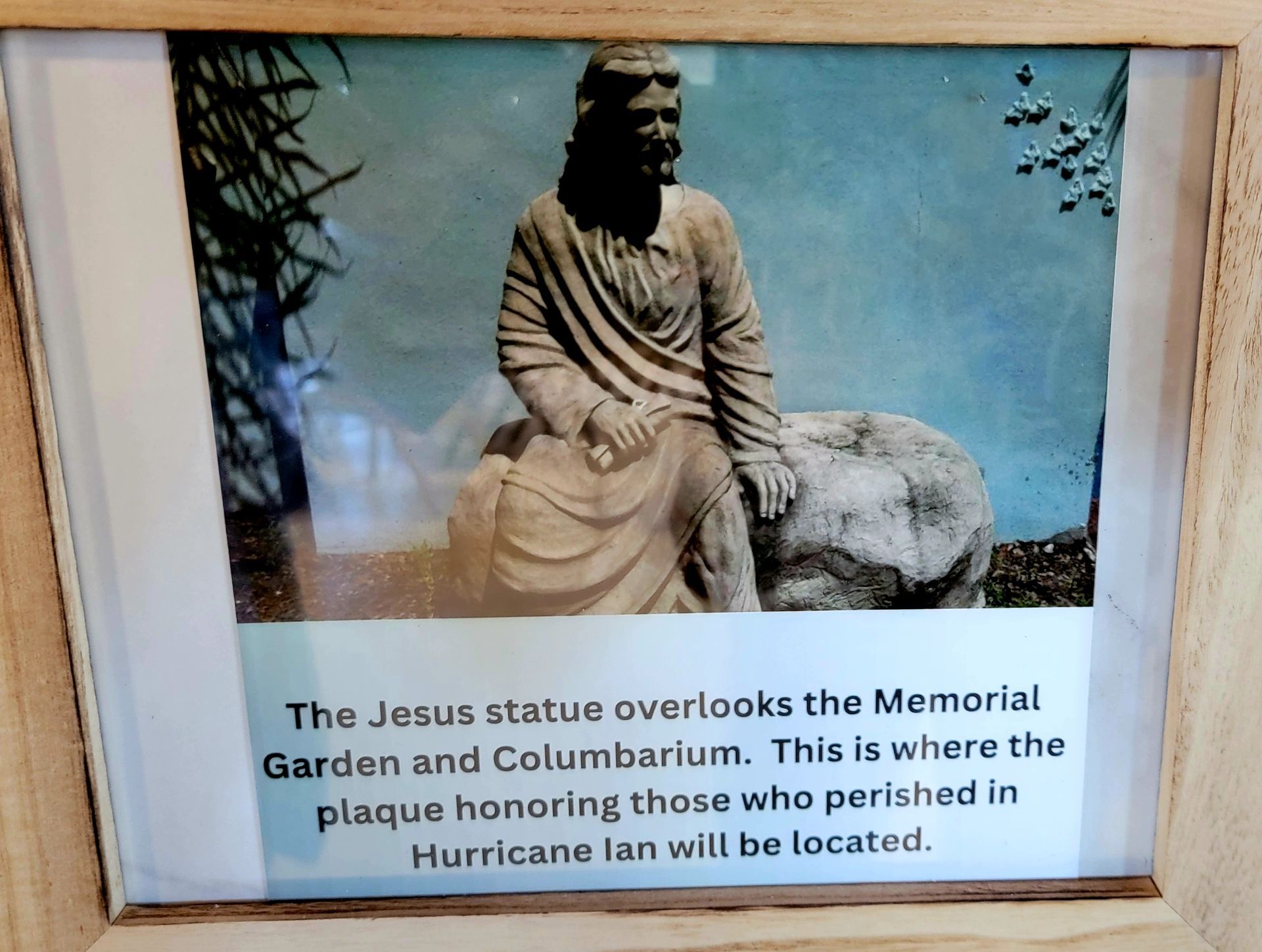 Jesus statue overlooking a memorial garden, where a plaque honoring Hurricane Ian victims will be.