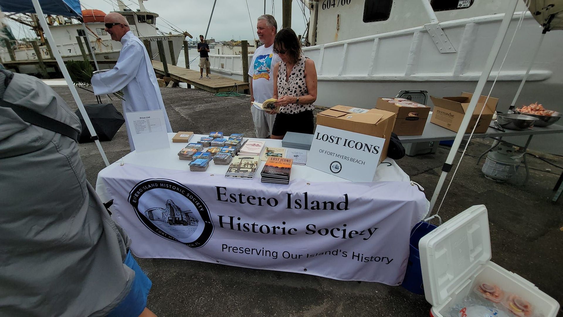 A table with a sign that says ' foster island historic society ' on it