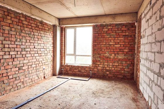 View of a room with brick wall
