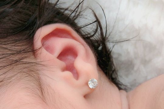 Baby with earrings - Custom Jewelry, Engraving and Jewelry Repairs in Cambridge, Massachusetts