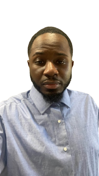 A man with a beard is wearing a blue shirt and taking a selfie.