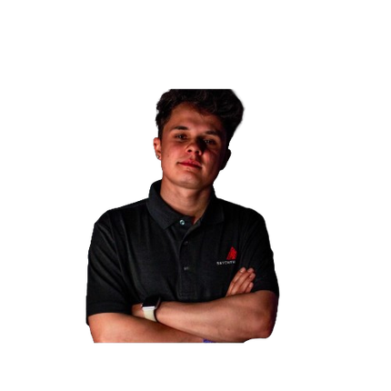A young man in a black polo shirt is standing with his arms crossed.