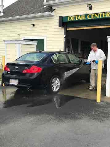 Happy Couple talking with employee - Auto Detailing in Norfolk, MA