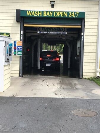 Black Car inside shop - Car Wash in Norfolk, MA