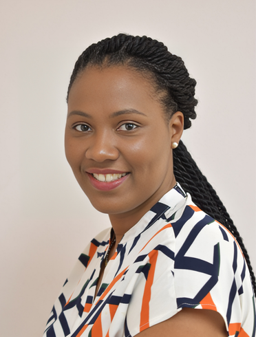 A woman wearing a striped shirt is smiling for the camera