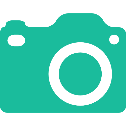 A green camera with a white circle in the middle.