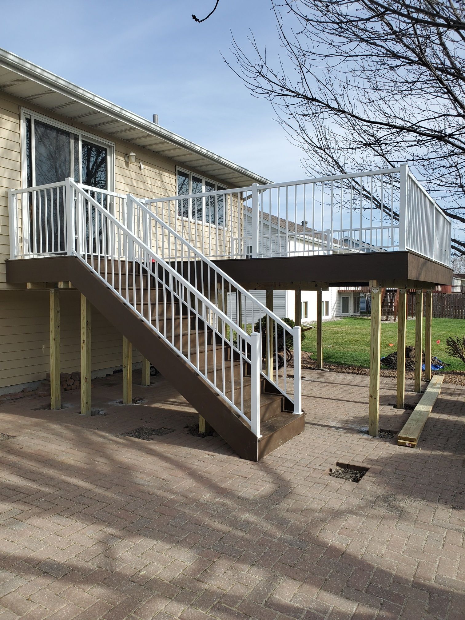 A house with a deck and stairs leading up to it