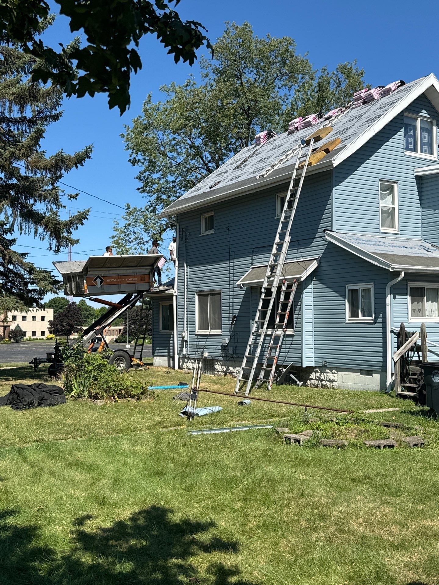 Diamond Roofing Pros using roofing tools