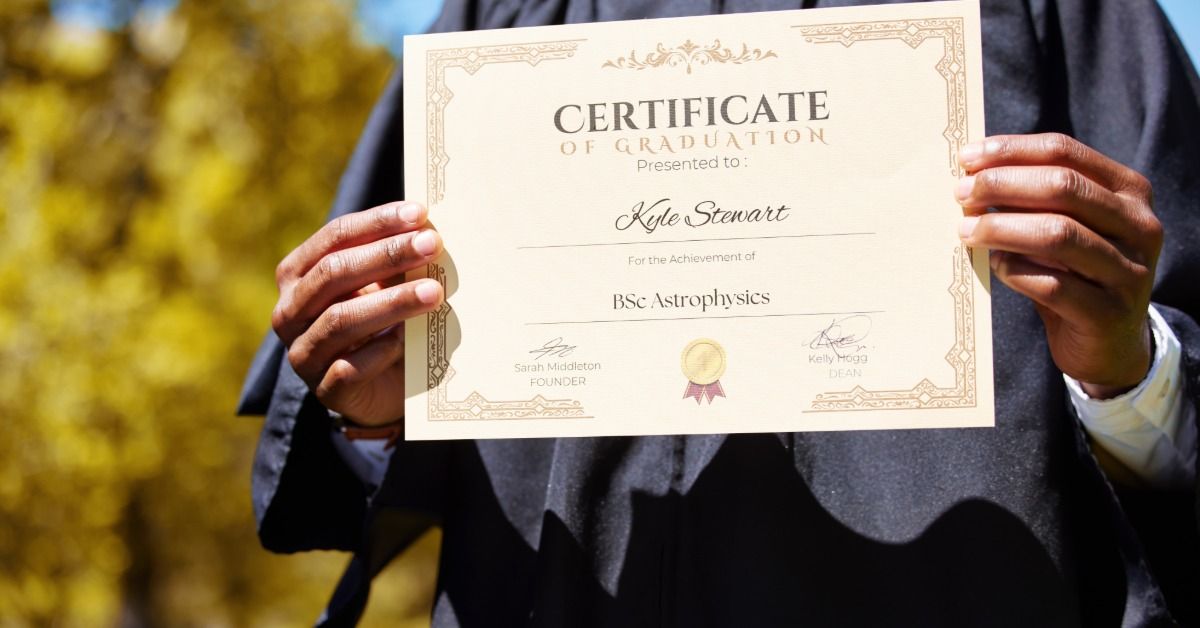 A person wearing a black graduation gown holds out a certificate of graduation in front of them.