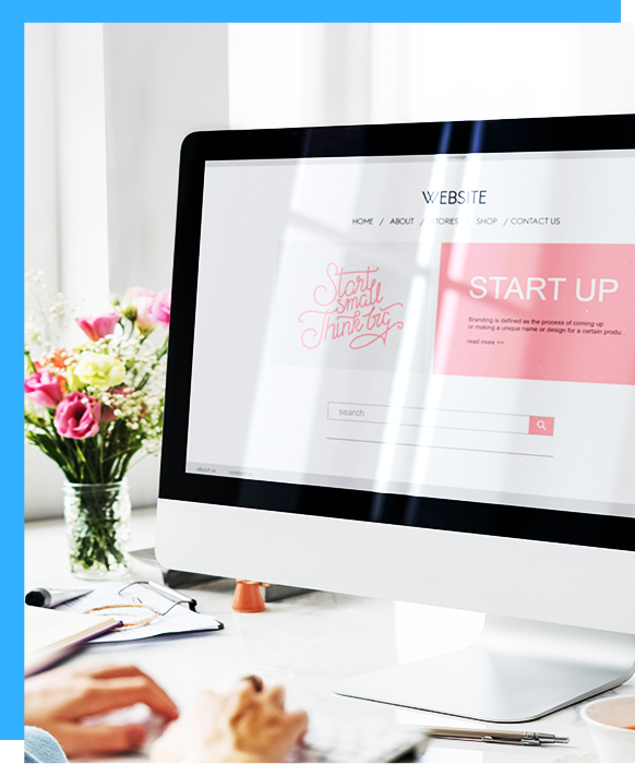A person is using a computer with a start up page on the screen.