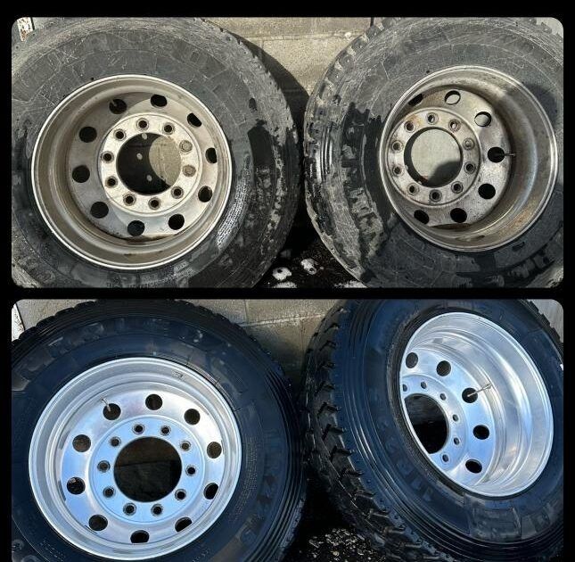 Four truck tires and rims in a grid, two pairs, with black tires and silver rims.