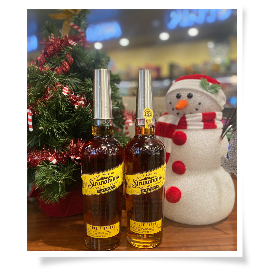 Stranahans Single Barrel Bottles in a Christmas scene