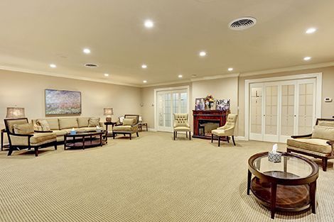 A living room filled with furniture and a fireplace.