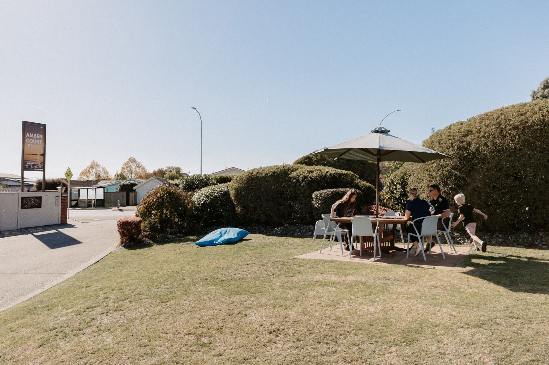 A Red Helicopter Is Sitting On Top Of A Mountain — Ambercourt Motel in Robina, QLD