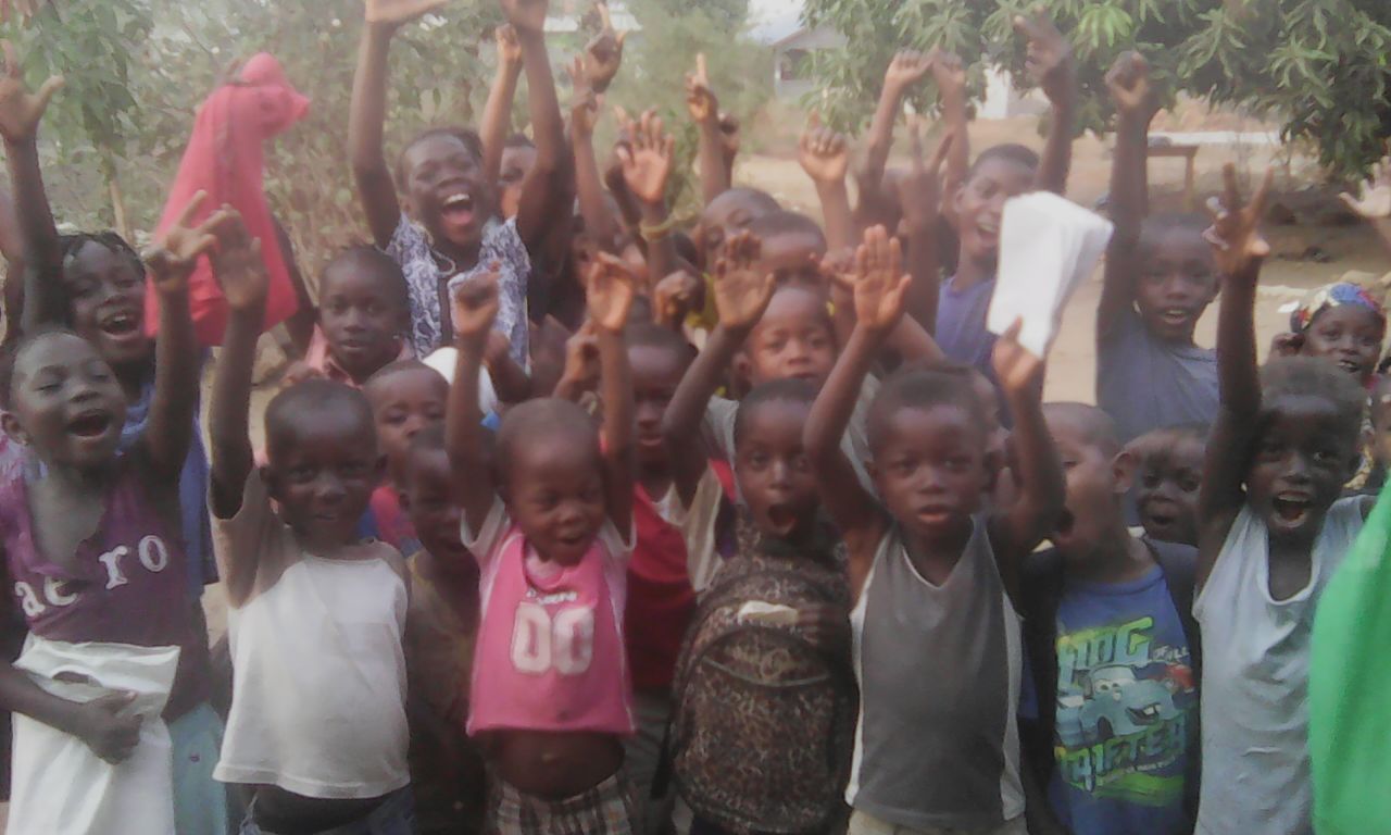 children raising their hands up