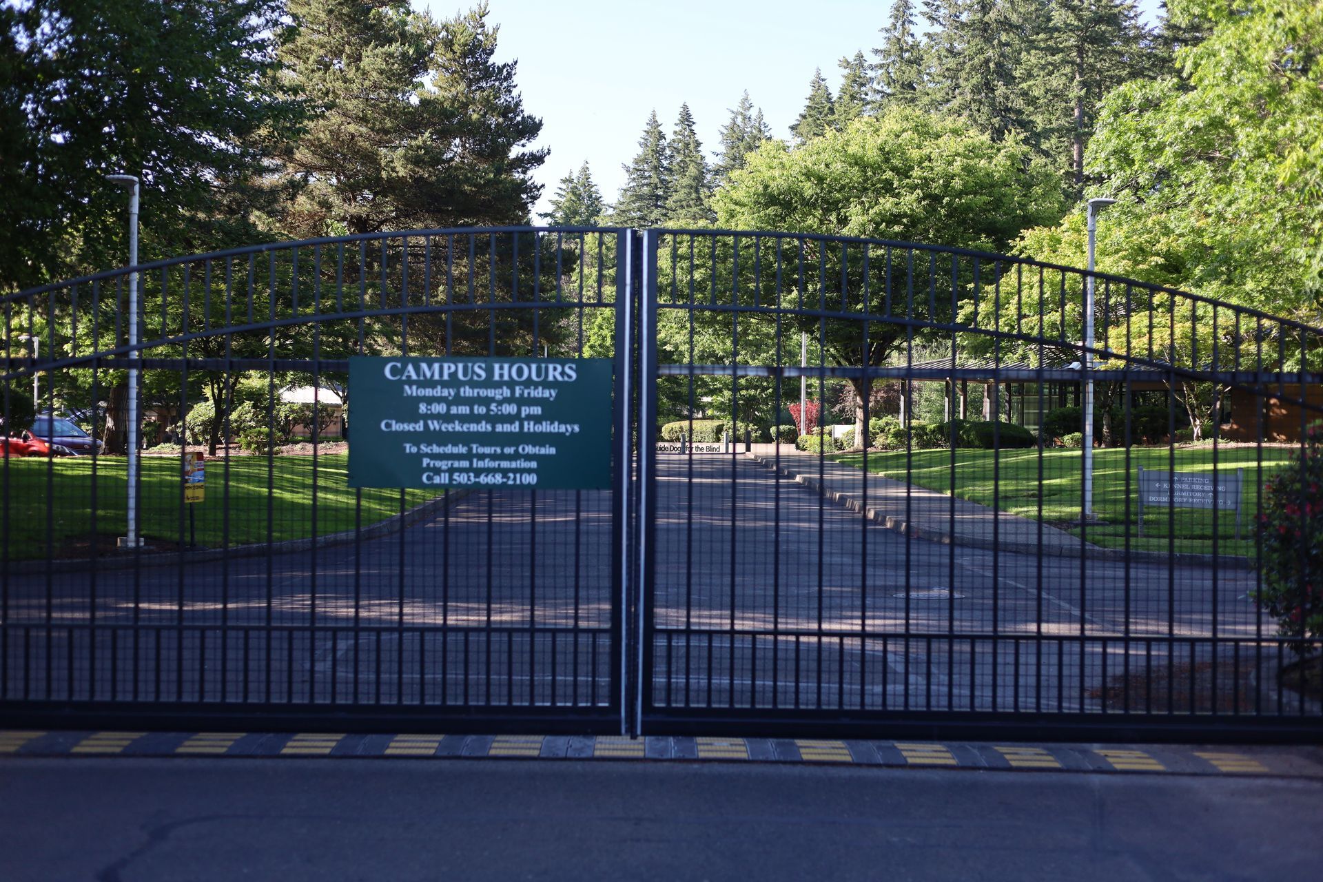 Black gates at an entrance with a 