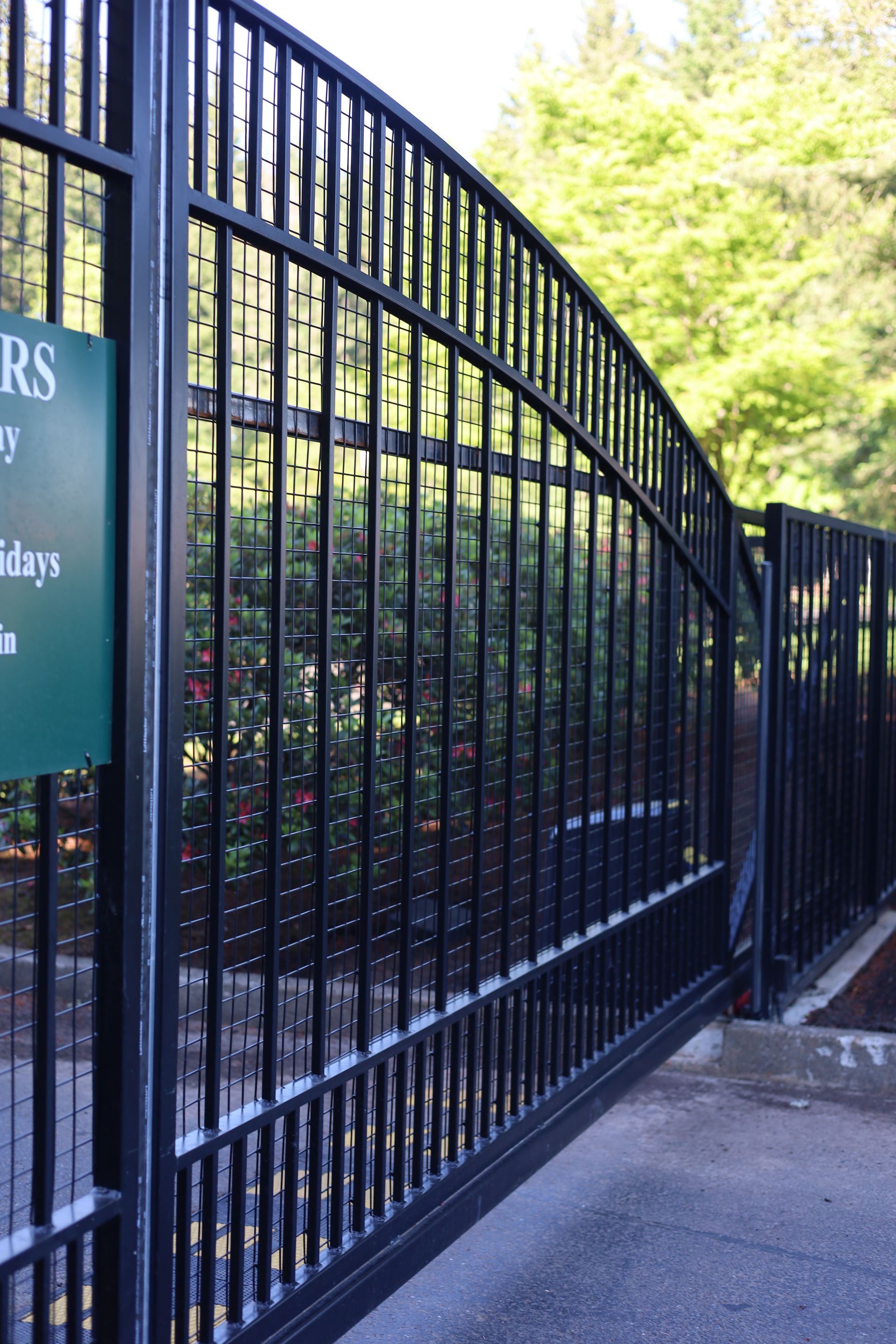 A fence with a sign that says ' rs ' on it