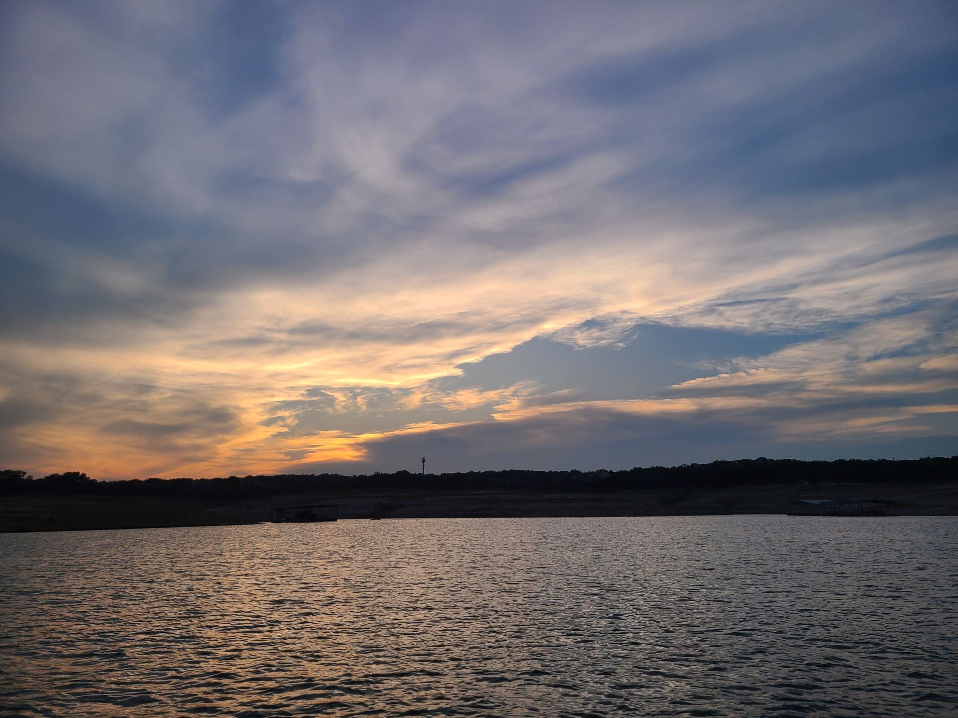 A sunset viewed from a pontoon boat on our sunset cruise on Lake Travis in Austin Texas TX