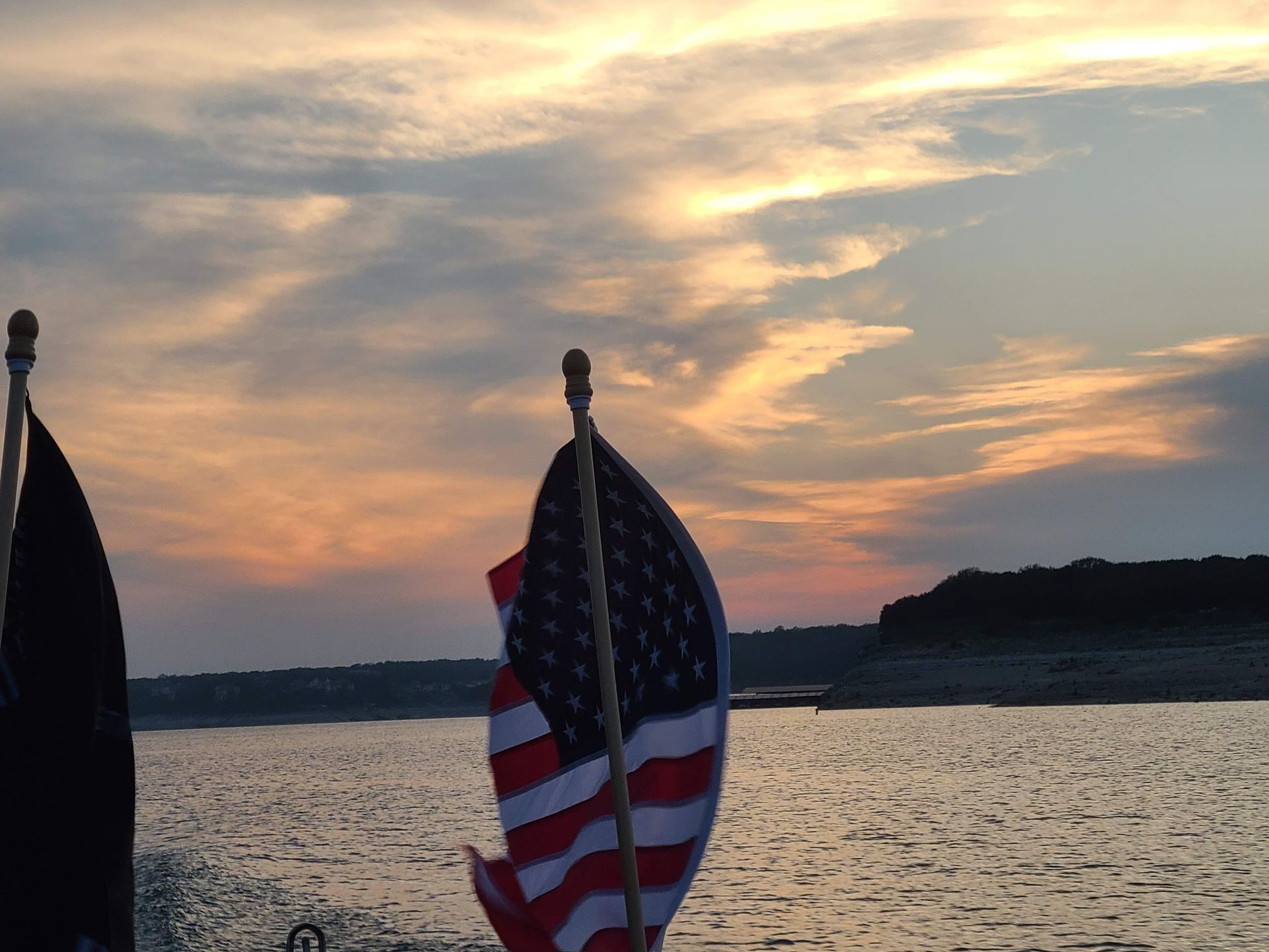 A sunset viewed from a pontoon boat on our sunset cruise on Lake Travis in Austin Texas TX